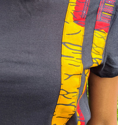 Black t-shirt with yellow and red Kente stripes