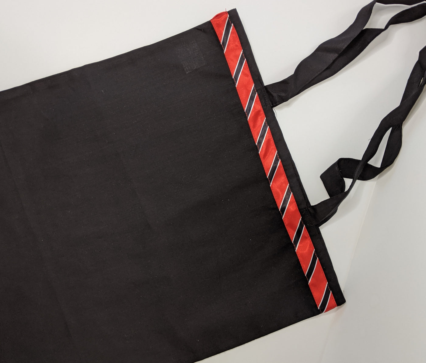 Black tote bag with Trinidad flag detail