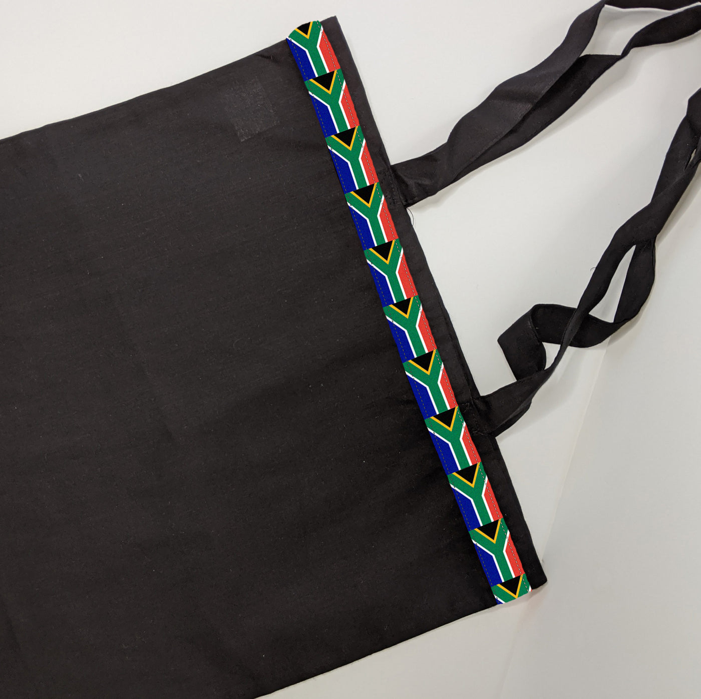 Black tote bag with South Africa flag detail